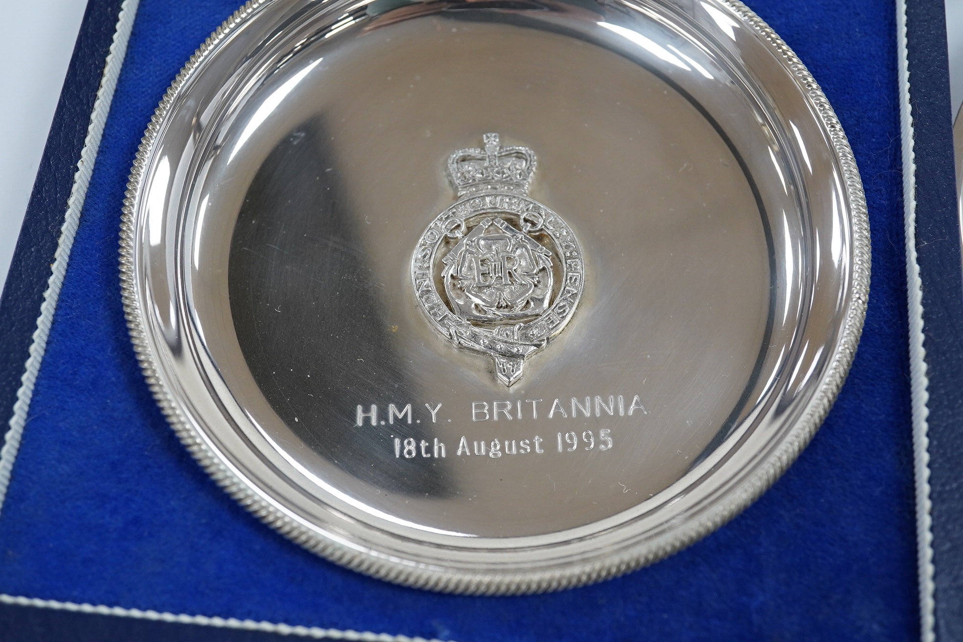 Sundry small silver including a modern wine funnel, silver dishes including cased, cigarette cases, sovereign case, wine label etc. Condition - poor to fair
